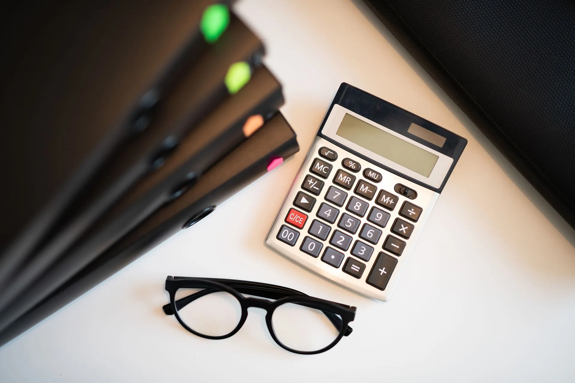 Calculator glasses and folders for year-end accounts E P Accountants Worcestershire